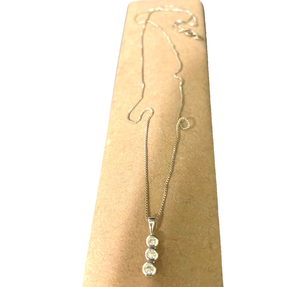 This necklace from Zales features a 3/4 carat 3 diamond pendant.